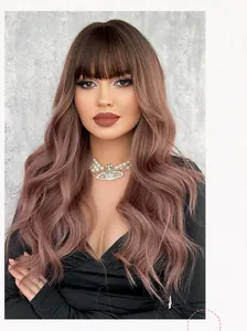 Detail shot of wavy pink-brown long wig with bangs on a model with grey background