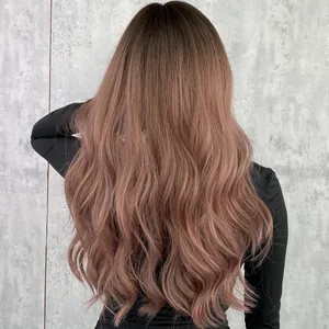 Long wavy synthetic wig in pinkish brown ombre with natural voluminous curls back view