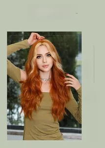 Detailed view of long wavy orange hair with blonde highlights on a fashion wig
