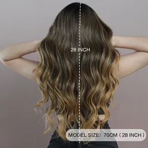 28 inch long ombre brown to blonde wavy T lace wig showing natural curls on professional model