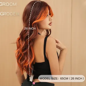 Long wavy wig with ginger orange balayage and parted bangs in 26 inch length