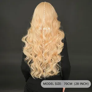 Long wavy 28 inch strawberry blonde lace wig shown from the back on a gray background