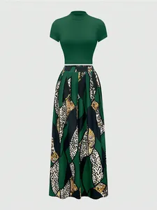 Detail of high neck dark green top with leopard and geometric print wide leg trousers