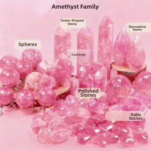 Collection of pink rose quartz healing stones in sphere, tower, and heart-shaped carvings