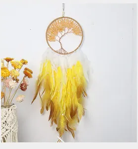 Detail of tree of life dreamcatcher with yellow stones and gradient feathers wall decor