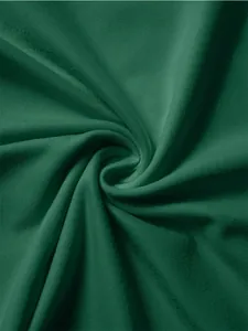 Detailed macro texture of dark green knitted fabric showing high drape and soft weave