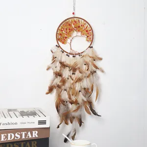 Handmade Tree of Life dream catcher with warm colorful beads and hanging brown feathers