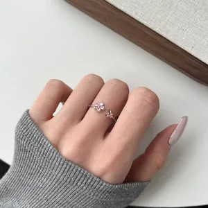 Adjustable S925 silver ring featuring pink flower zircon and small butterfly detail