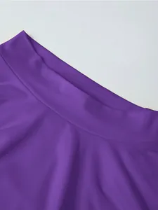 Detail of sewing and fabric texture on a deep purple sleeveless fashion set for women