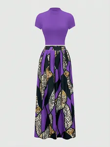 Detail of purple mock neck crop top and baroque print maxi skirt two-piece set