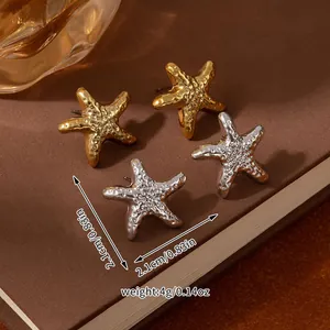 Macro shot of gold and silver textured starfish stud earrings with 2.1cm size measurements