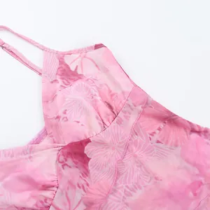 Detail of pink floral mesh camisole featuring delicate ruffles and sheer breathable fabric