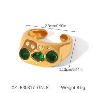 Close-up of gold stainless steel ring with green heart zircon showing dimensions and weight