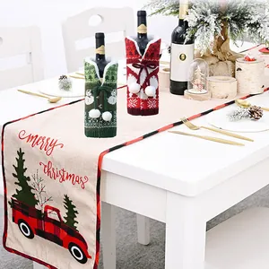 Christmas table runner and knit wine bottle covers with red truck and snowman patterns
