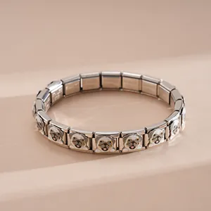 Detail of Italian charm bracelet with stainless steel links and cute pug enamel charm