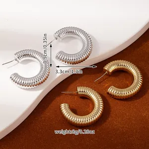Detail view of 33mm thick C-shaped hoop earrings with textured finish and dimensions