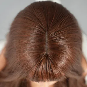 Detailed top view of realistic scalp parting on long wavy reddish-brown synthetic wig