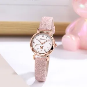 Detail of pink quartz watch with rose gold case and Mickey silhouette on white dial