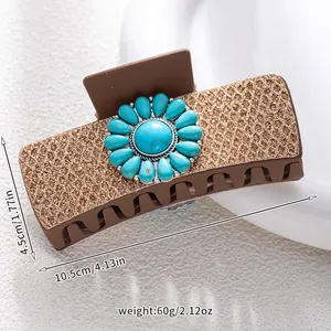 Detail view of turquoise sunflower claw clip with gold glitter and dimensions 10.5cm