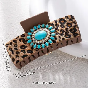 Detailed view of leopard print hair claw with turquoise bohemian center and size markers