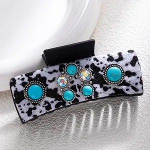 Bohemian hair claw with turquoise stones, cow print fur texture and sparkling rhinestones