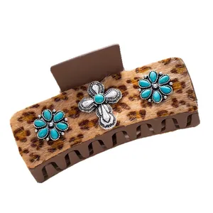 Bohemian leopard print hair claw with turquoise accents and vintage cross metal details