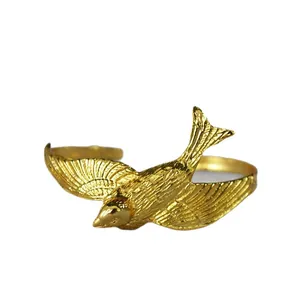 Elegant gold swallow open ring with textured feather wings in a minimalist style