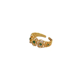 Vintage gold filigree ring with green gemstone, pearls and adjustable open band