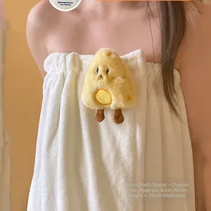 Close-up of white coral fleece wearable towel with cute plush cheese doll detail