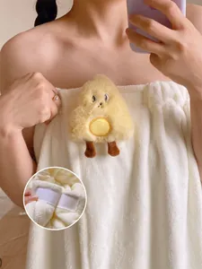 Detail of white wearable bath towel showing the secure Velcro closure and soft plush texture