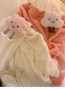 Detail of soft coral fleece bath towel wrap with cute 3D plush cloud doll ornament