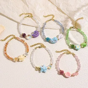 Detail of 6-piece ocean-themed beaded bracelets with shell, starfish and turtle charms