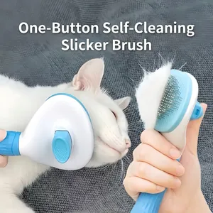 Self-cleaning blue and white pet grooming brush for cats with massage needles