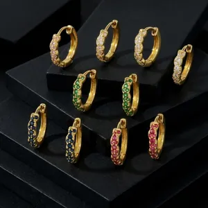 Macro shot of gold-plated hoop earrings with vibrant pave-set zircon stones in five colors