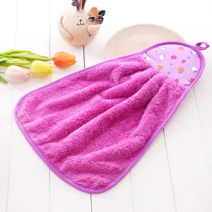 Detail of purple coral fleece hand towel with apple print and convenient hanging loop