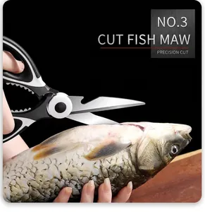 Detail of heavy duty stainless steel kitchen shears gutting fish with sharp blades