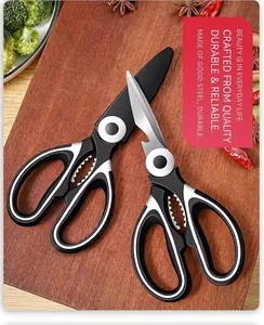 Macro detail of heavy duty stainless steel kitchen scissors on a rustic wooden board