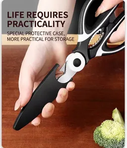 Multi-purpose kitchen shears with non-slip handle and special protective case on wood