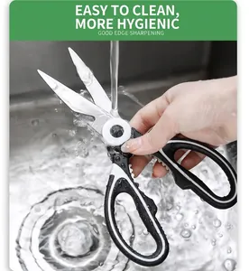 Close-up of stainless steel kitchen scissors being rinsed under running water for easy cleaning