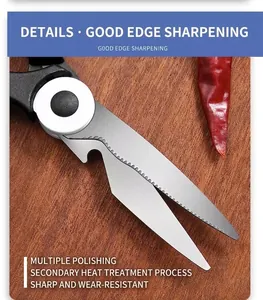 Macro detail of stainless steel kitchen scissors blade with serrated edge and wood background