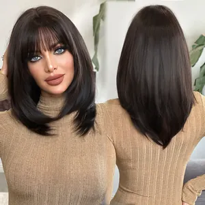 Detail view of medium-length brown wig with bangs showing natural fiber texture and layers