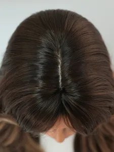 Macro detail of bionic scalp part on dark brown long wavy wig for a realistic look
