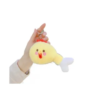 Portachiavi peluche coscia di pollo con viso di pulcino giallo e morbida consistenza
