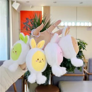 Set of four colorful plush rabbit keychains in green, yellow, pink, and brown soft faux fur