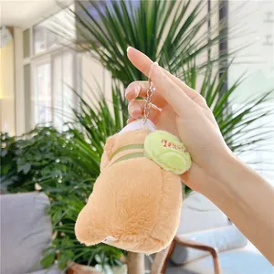 Close-up of soft brown capybara plush keychain with green Jennie embroidery patch