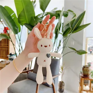 Cute cream plush rabbit keychain with heart patch and gold metal ring for bags