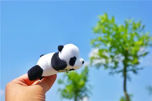Detail of cute plush panda brooch with soft fur texture and metal clip for accessories