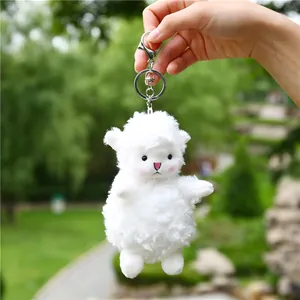 Cute white plush sheep keychain with curly wool texture and metal clasp for bag decor