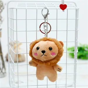 Macro detail of cute lion plush keychain with soft mane and silver lobster clasp