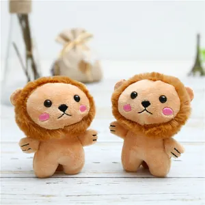 Cute plush lion keychain pendant with soft fur and mane on a cozy wooden background